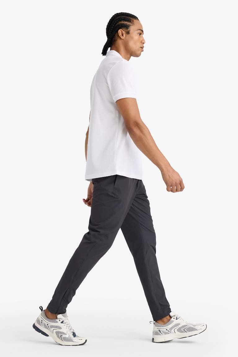 DeFactoFit Slim Fit Dar Kesim Çift Cepli Fermuarlı Paça Dokuma Jogger