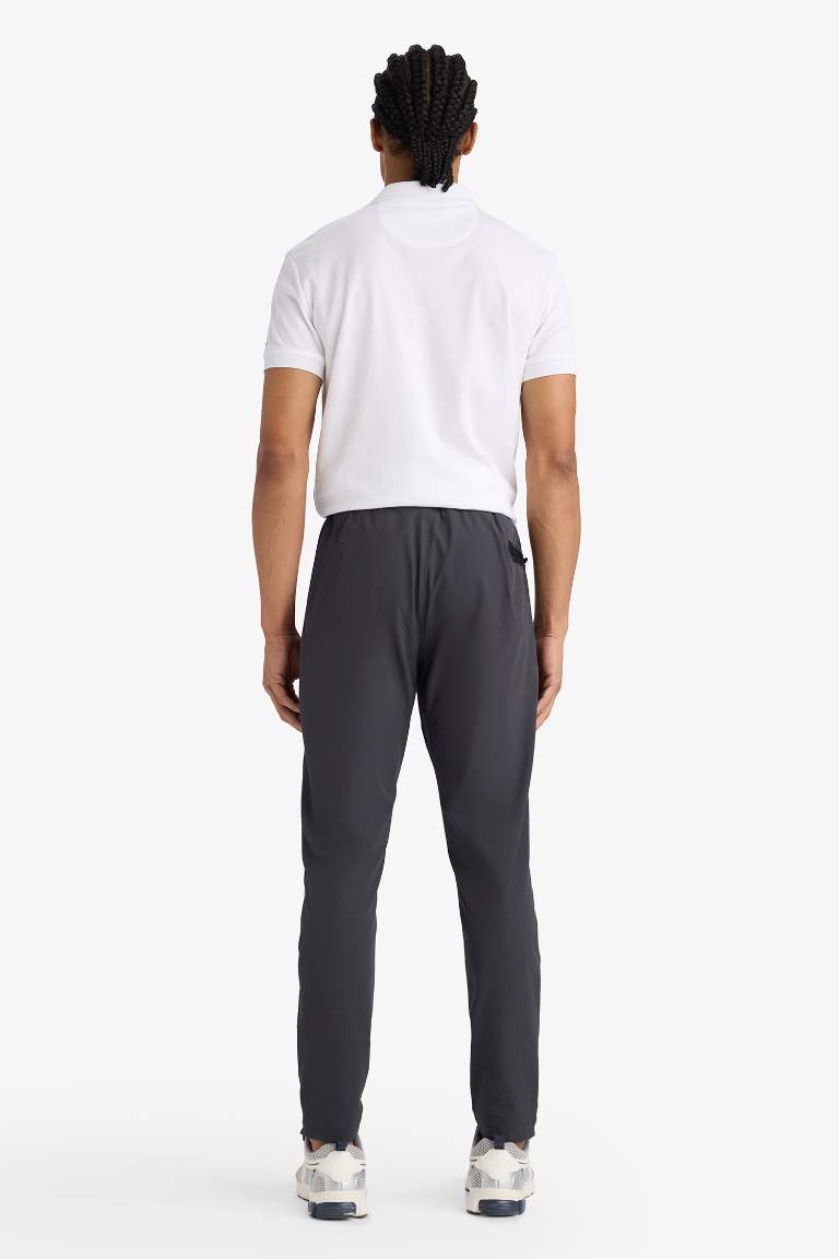DeFactoFit Slim Fit Dar Kesim Çift Cepli Fermuarlı Paça Dokuma Jogger