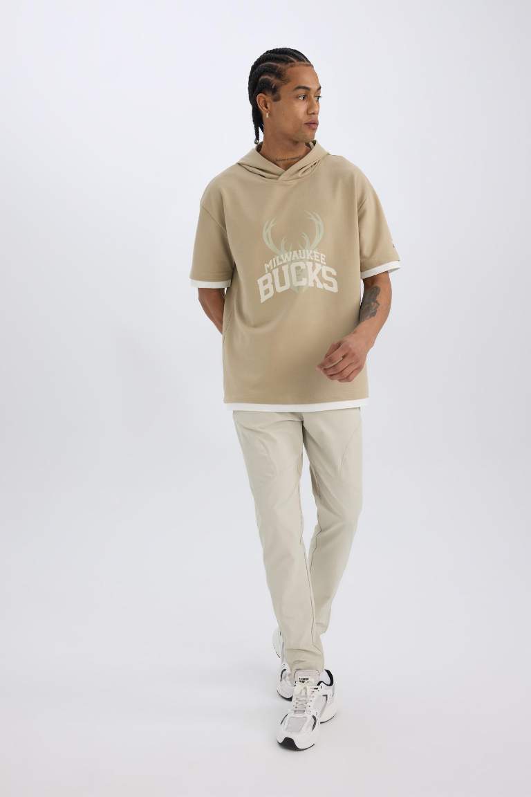 بنطلون بجامة رياضي جوجر منسوج سليم فيت من DeFactoFit