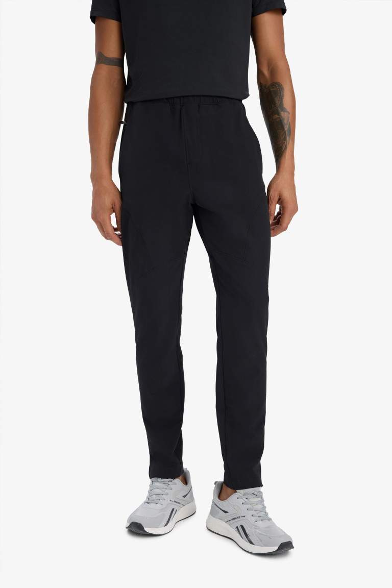 DeFactoFit Esnek Kumaş Sporcu Jogger Eşofman Altı Slim Fit Dar Kesim Dokuma Üç Cepli Fermuarlı Paça