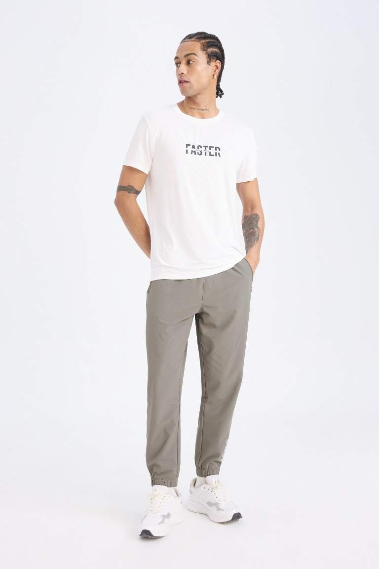 DeFactoFit Dokuma Esnek Multifonksiyonel Sporcu Jogger Eşofman Altı Slim Fit Dar Kesim Çift Cepli