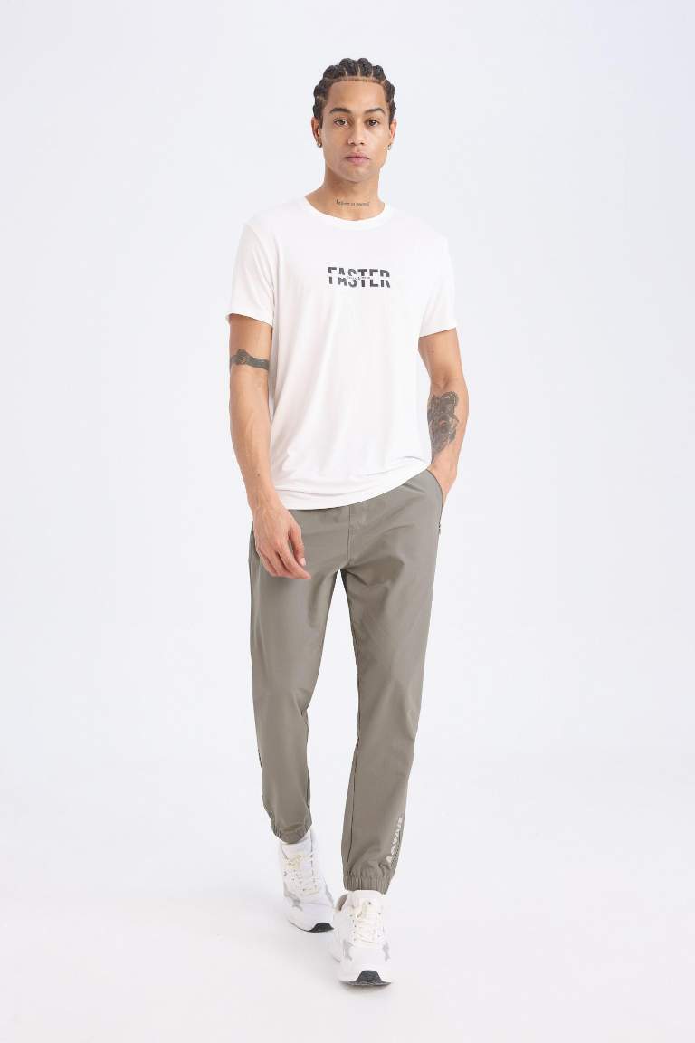 DeFactoFit Dokuma Esnek Multifonksiyonel Sporcu Jogger Eşofman Altı Slim Fit Dar Kesim Çift Cepli