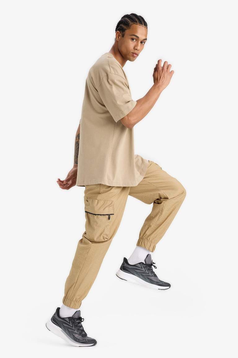 DeFactoFit Oversize Geniş Kalıp Kargo Cepli Sporcu Dokuma Pantolon