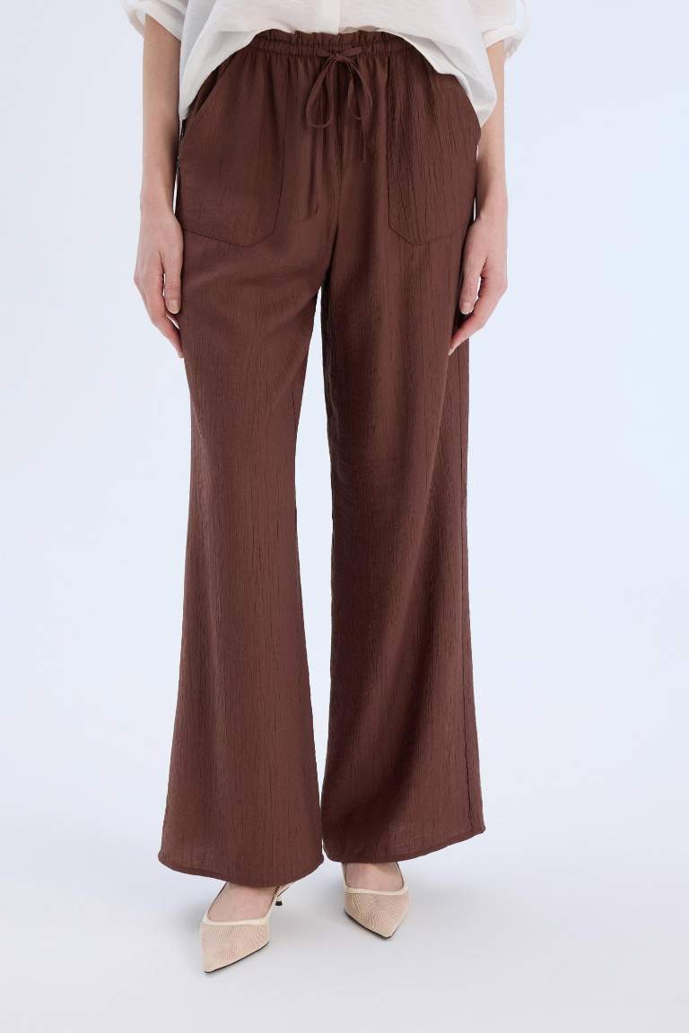 Pantalon large à taille haute avec poches