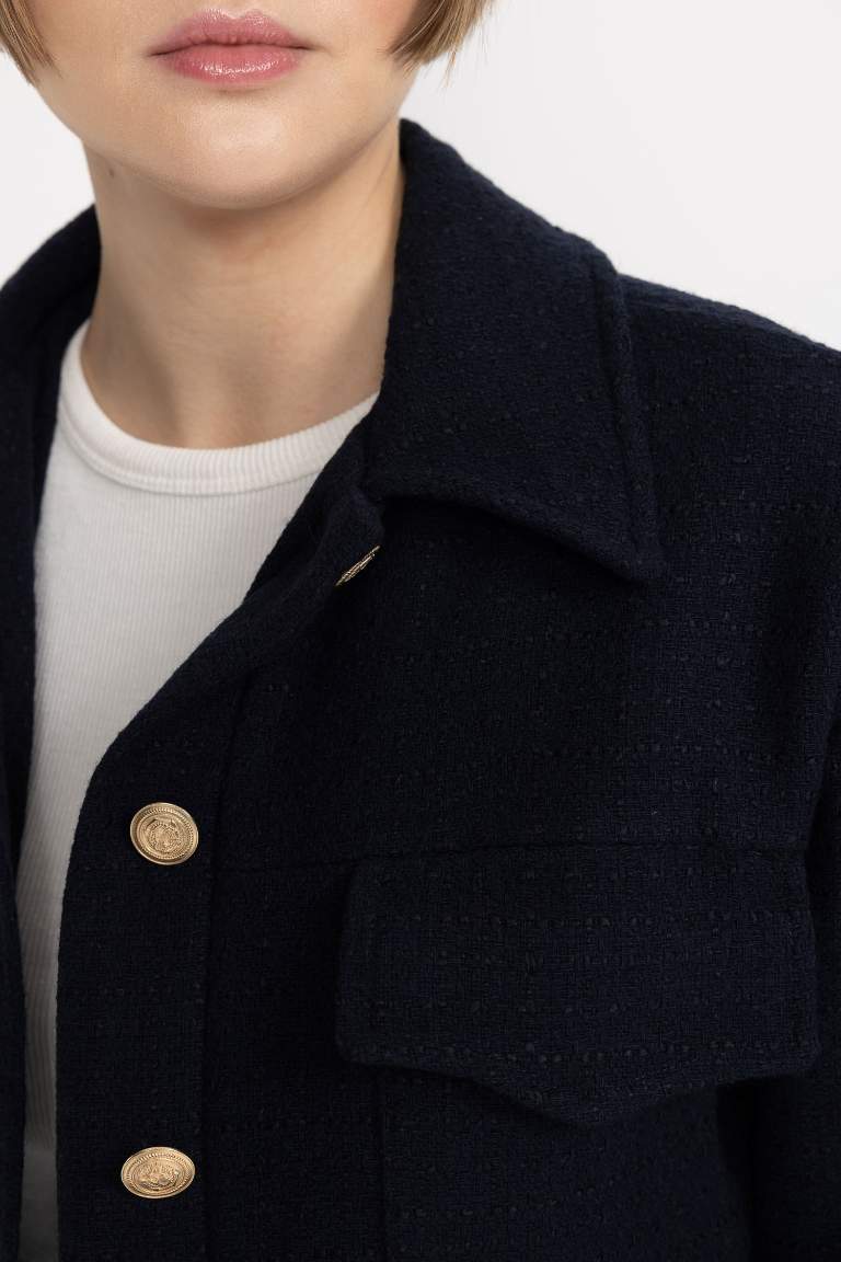 Veste blazer à col polo en tissu tweed avec poches à fermeture par boutons plats