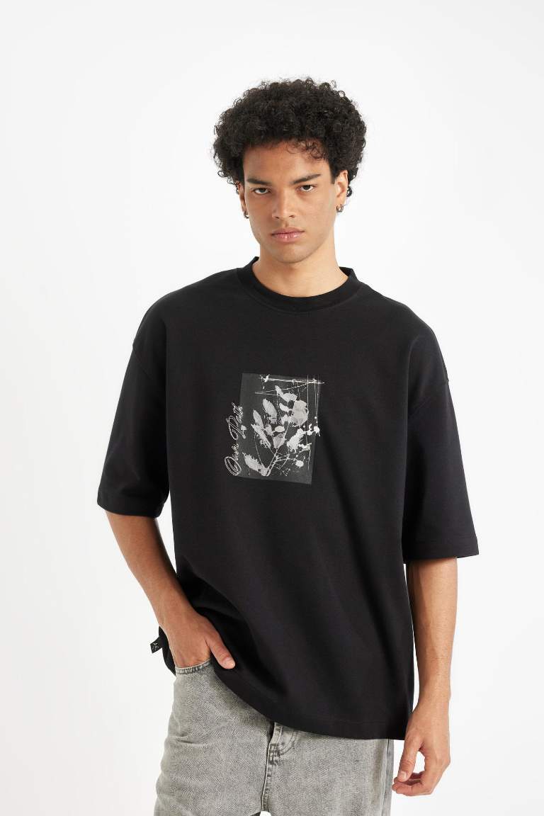 T-shirt noir Boxy manches courtes et col rond imprimé de Fleurs