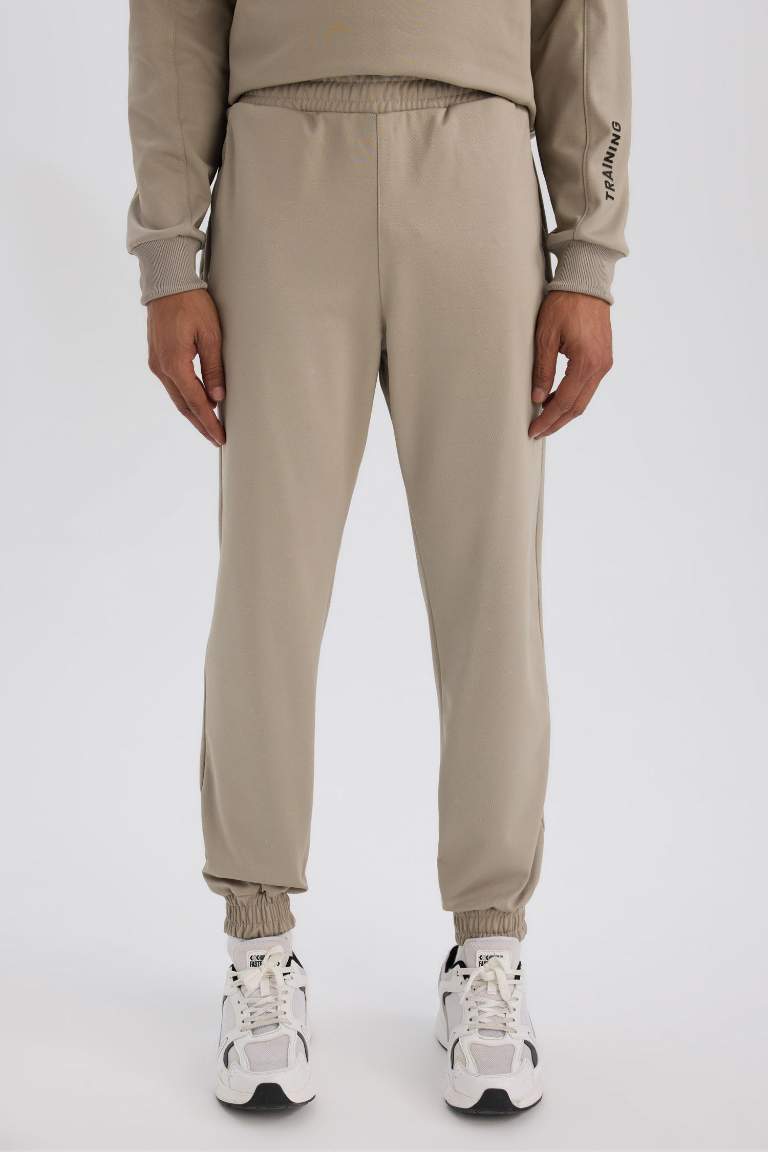 DeFactoFit Sporcu Jogger Eşofman Altı Loose Fit Beli Paçası Lastikli Cepli Pike
