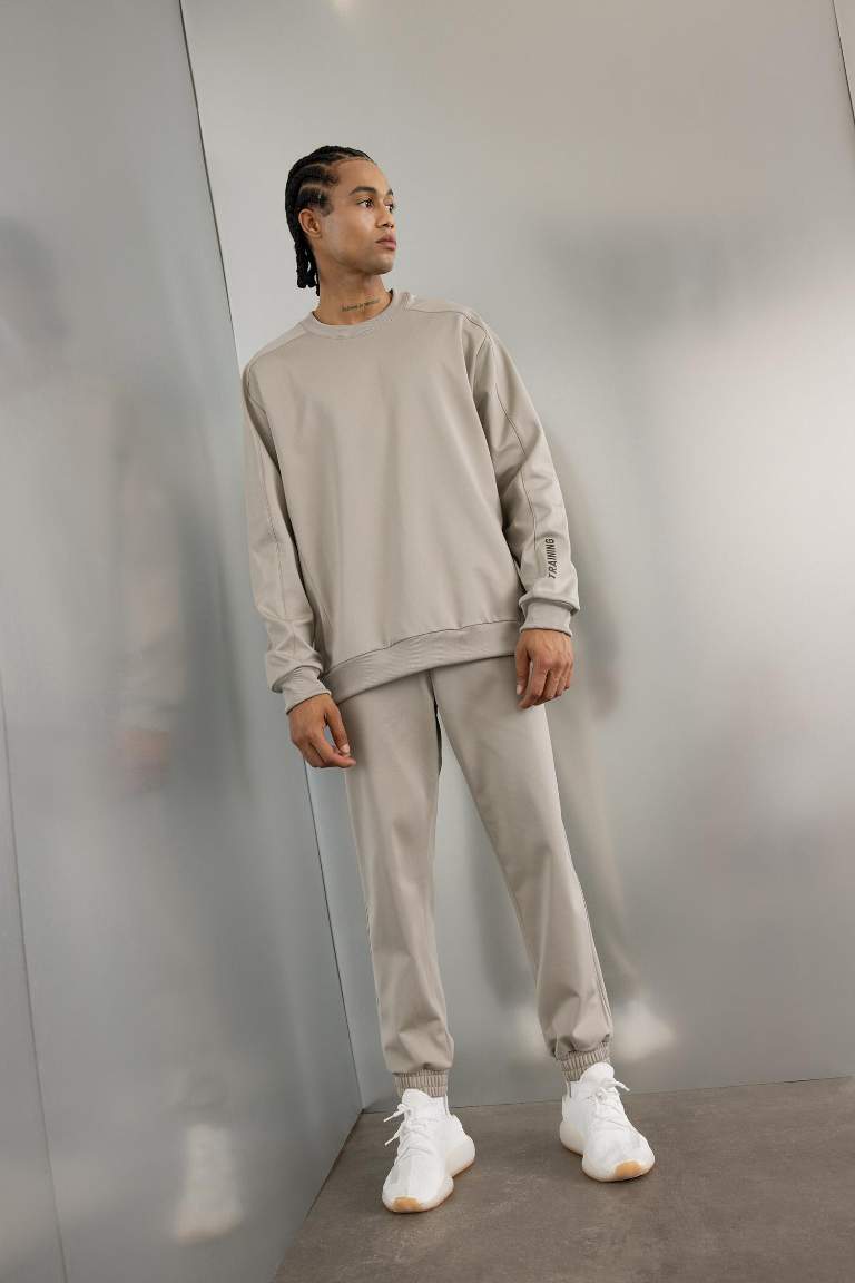 DeFactoFit Sporcu Jogger Eşofman Altı Loose Fit Beli Paçası Lastikli Cepli Pike
