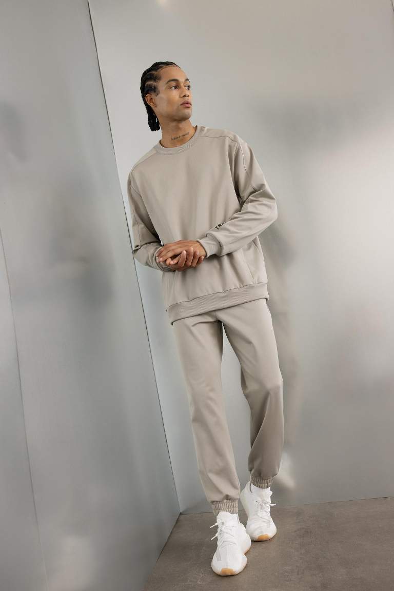 DeFactoFit Sporcu Jogger Eşofman Altı Loose Fit Beli Paçası Lastikli Cepli Pike