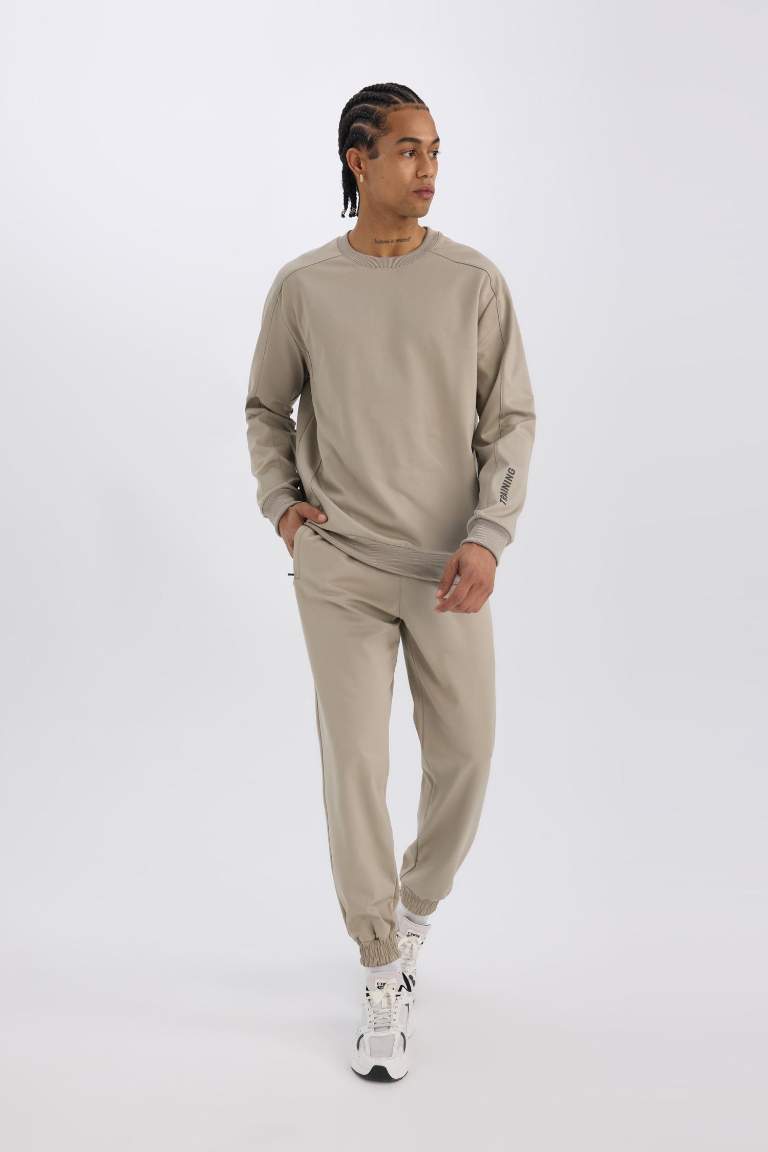 DeFactoFit Sporcu Jogger Eşofman Altı Loose Fit Beli Paçası Lastikli Cepli Pike