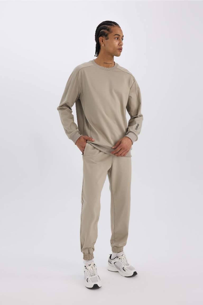 DeFactoFit Sporcu Jogger Eşofman Altı Loose Fit Beli Paçası Lastikli Cepli Pike