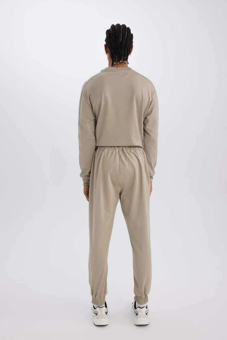 DeFactoFit Sporcu Jogger Eşofman Altı Loose Fit Beli Paçası Lastikli Cepli Pike
