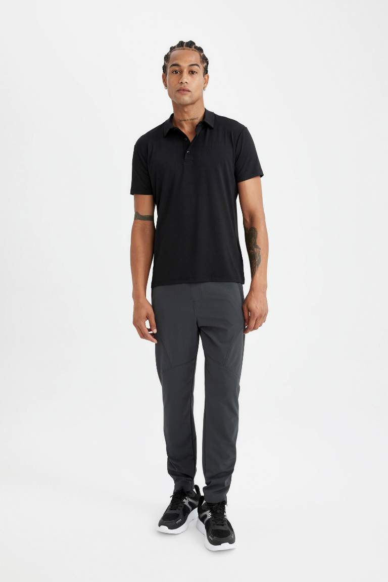 DeFactoFit Sporcu Dokuma Pantolon Slim Fit Dar Kesim Çift Cepli Fermuarlı Paça