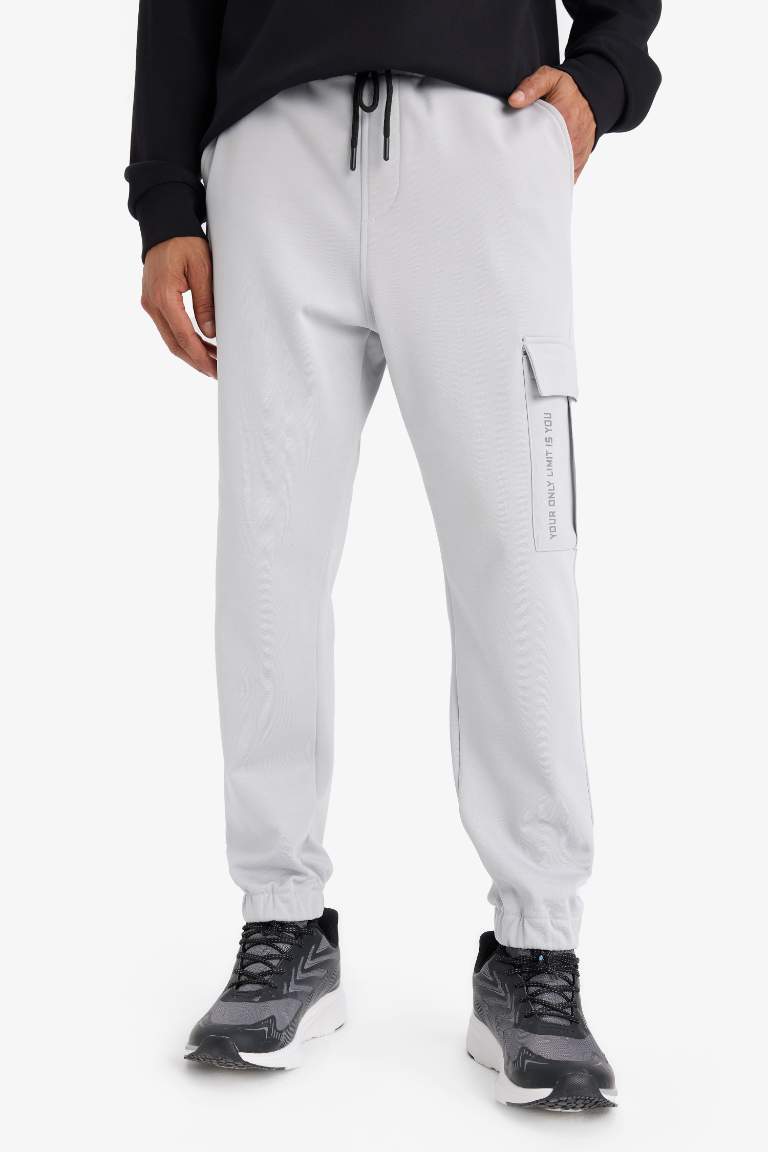 DeFactoFit Sporcu Jogger Eşofman Altı Standart Fit Üç Cepli Beli Bağcıklı Lastikli Paça