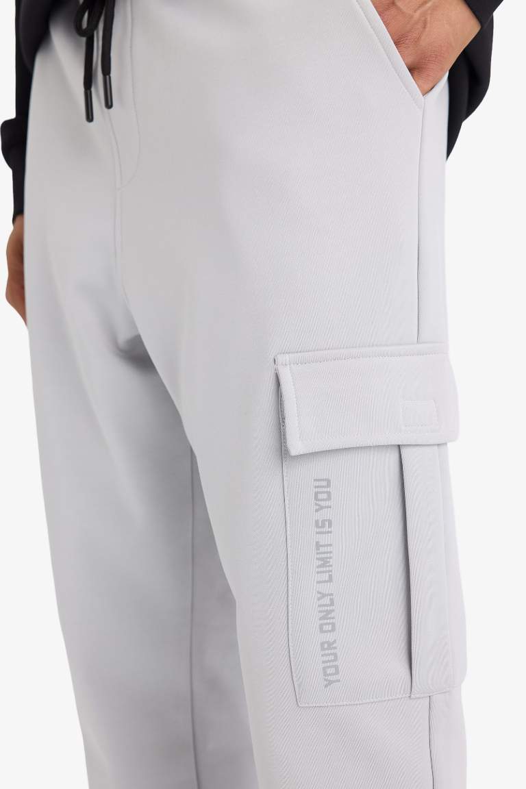 DeFactoFit Sporcu Jogger Eşofman Altı Standart Fit Üç Cepli Beli Bağcıklı Lastikli Paça