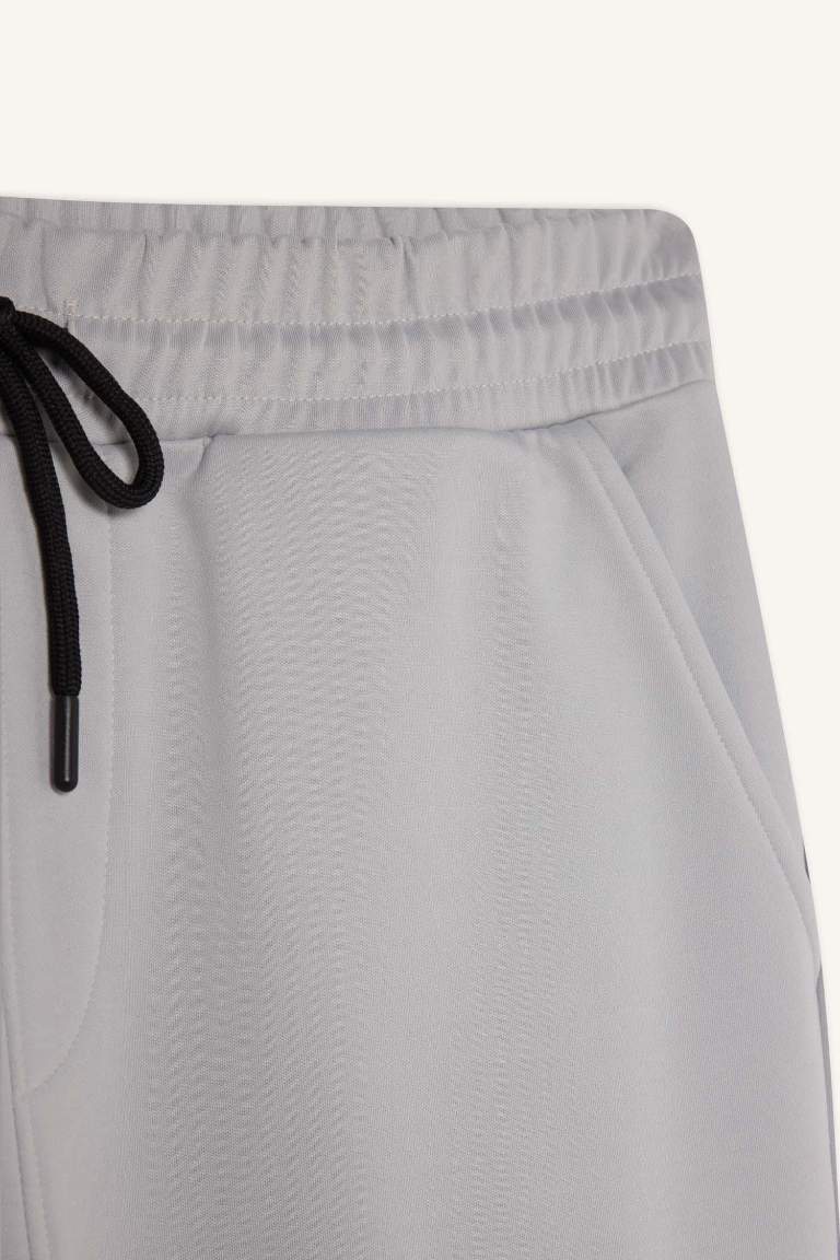 DeFactoFit Sporcu Jogger Eşofman Altı Standart Fit Üç Cepli Beli Bağcıklı Lastikli Paça