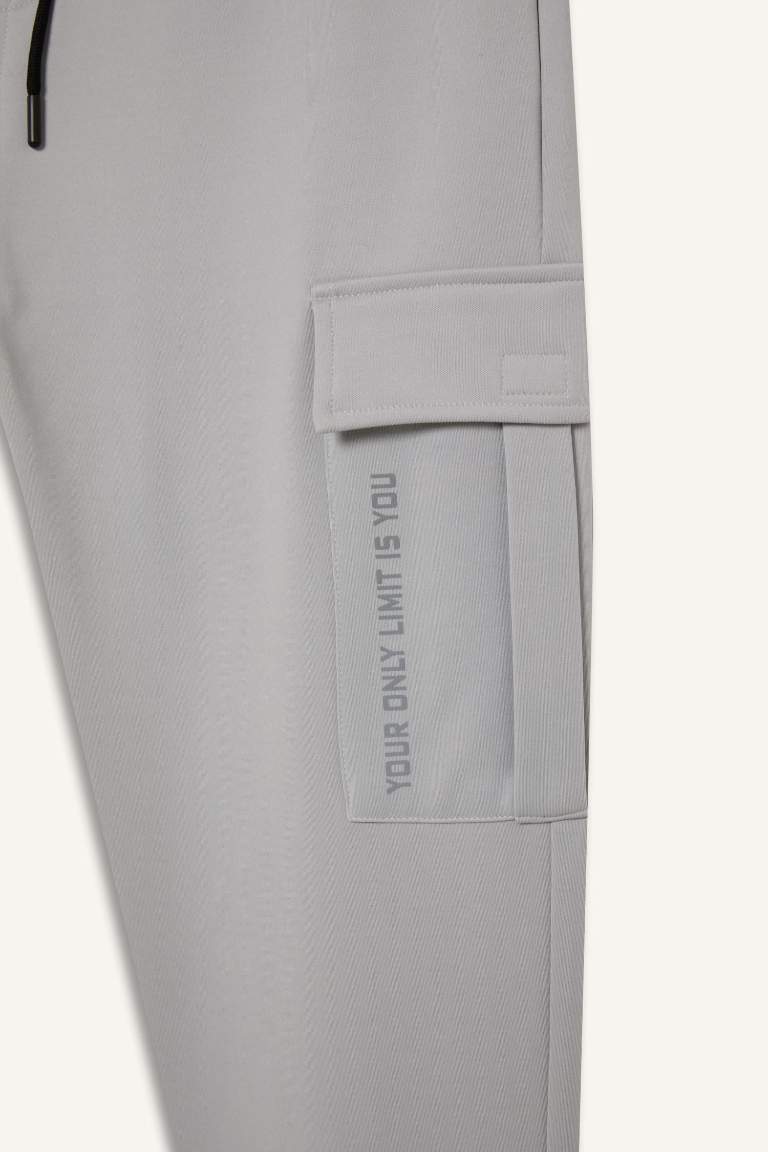 DeFactoFit Sporcu Jogger Eşofman Altı Standart Fit Üç Cepli Beli Bağcıklı Lastikli Paça