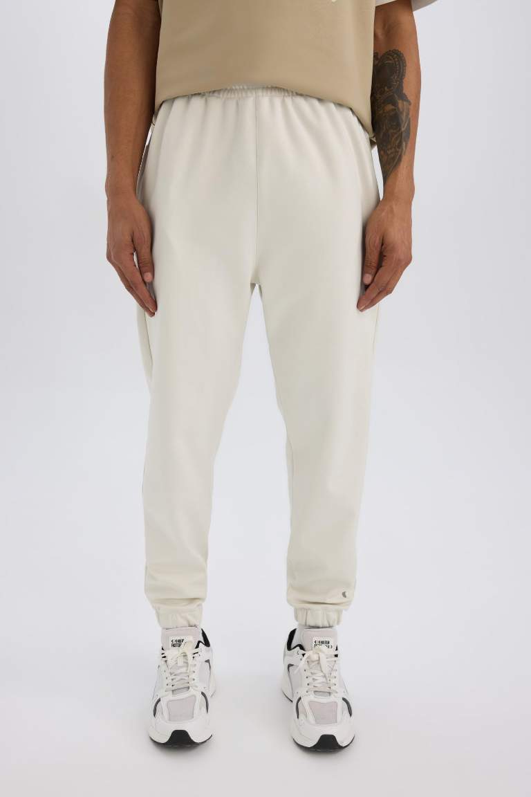 DeFactoFit Sporcu Jogger Eşofman Altı Standart Fit Basic Düz Cepli Beli Paçası Lastikli
