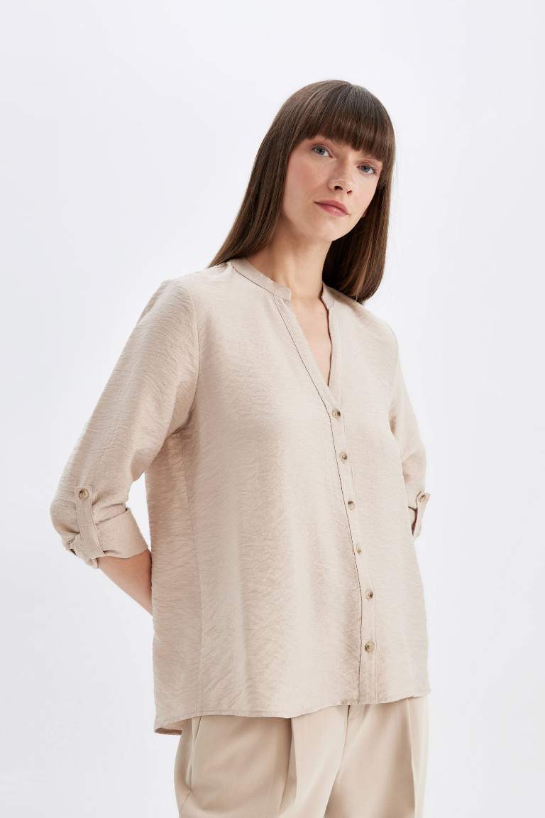 Chemise basique à manches longues avec détail de manche pliée, boutonnée