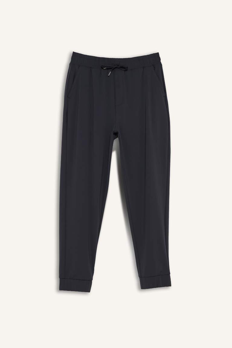 DeFactoFit Slim Fit Dar Kesim Standart Paça Multifonksiyonel Ultrastrech Sporcu Jogger Eşofman Altı