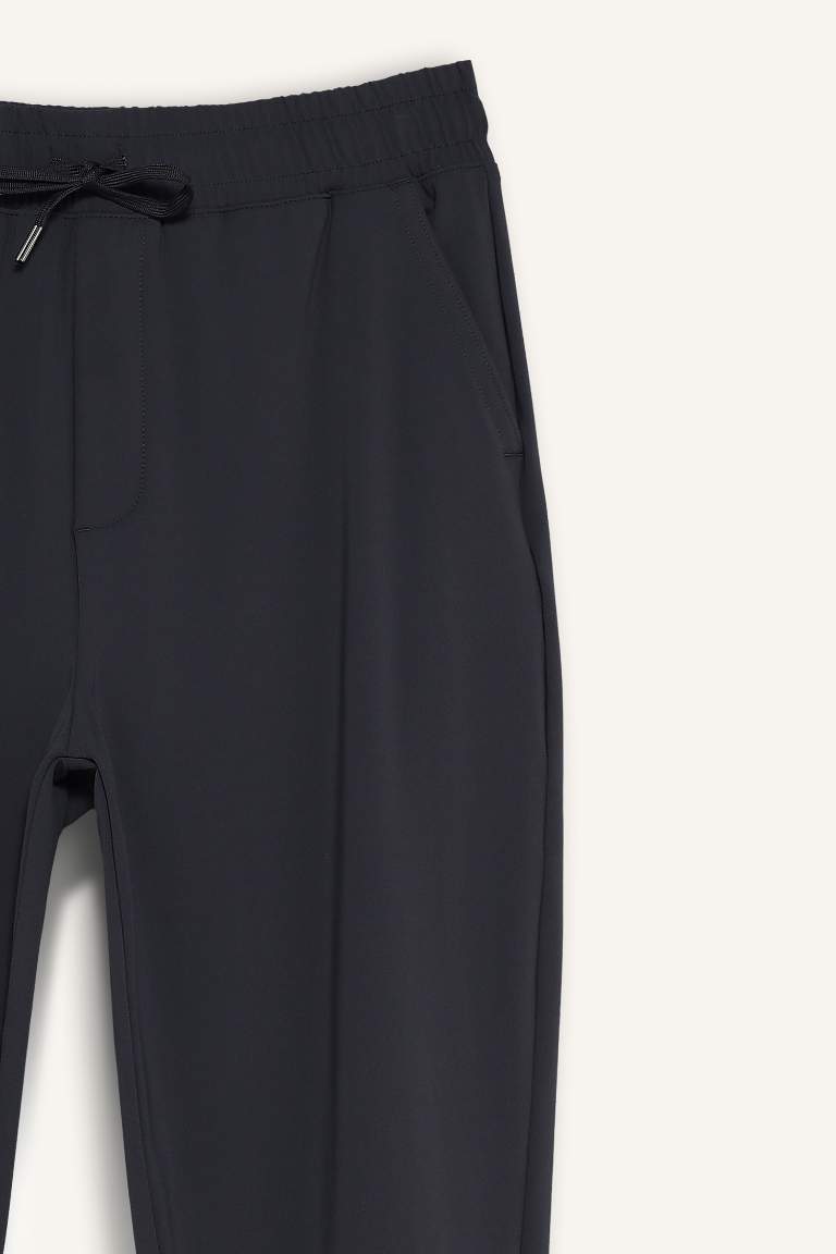 DeFactoFit Slim Fit Dar Kesim Standart Paça Multifonksiyonel Ultrastrech Sporcu Jogger Eşofman Altı