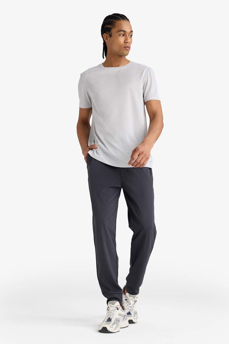 DeFactoFit Slim Fit Dar Kesim Standart Paça Multifonksiyonel Ultrastrech Sporcu Jogger Eşofman Altı