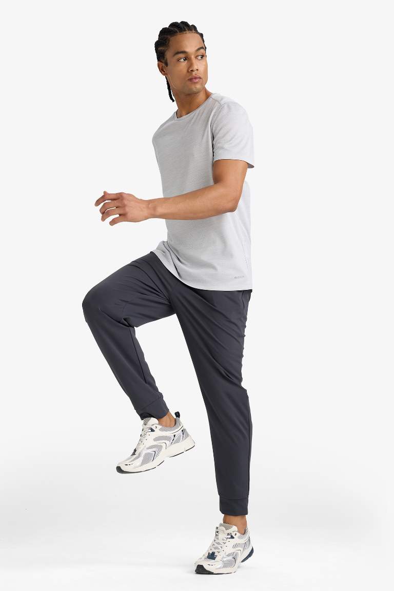 DeFactoFit Slim Fit Dar Kesim Standart Paça Multifonksiyonel Ultrastrech Sporcu Jogger Eşofman Altı