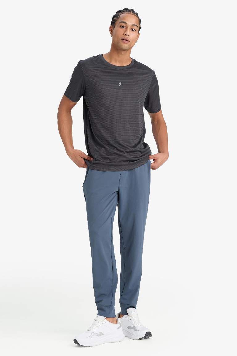 DeFactoFit Slim Fit Dar Kesim Standart Paça Multifonksiyonel Ultrastrech Sporcu Jogger Eşofman Altı