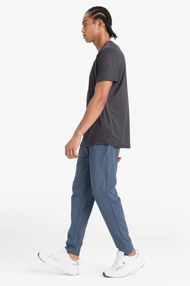 DeFactoFit Slim Fit Dar Kesim Standart Paça Multifonksiyonel Ultrastrech Sporcu Jogger Eşofman Altı