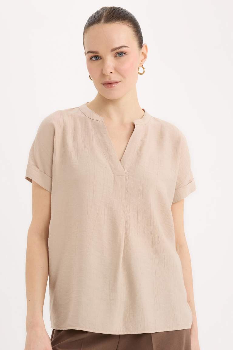 Blouse en tissu gaufré à col rond et manches courtes Coupe régulière