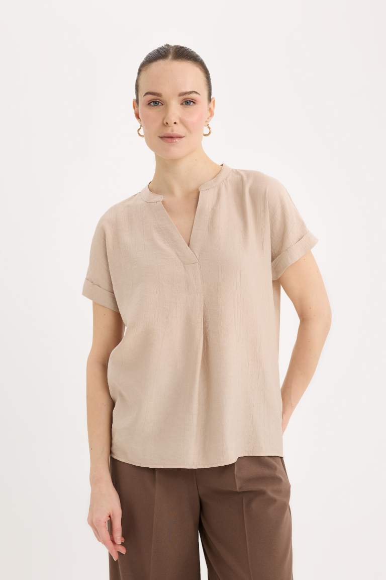 Blouse en tissu gaufré à col rond et manches courtes Coupe régulière