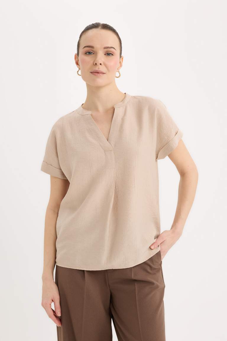 Blouse en tissu gaufré à col rond et manches courtes Coupe régulière