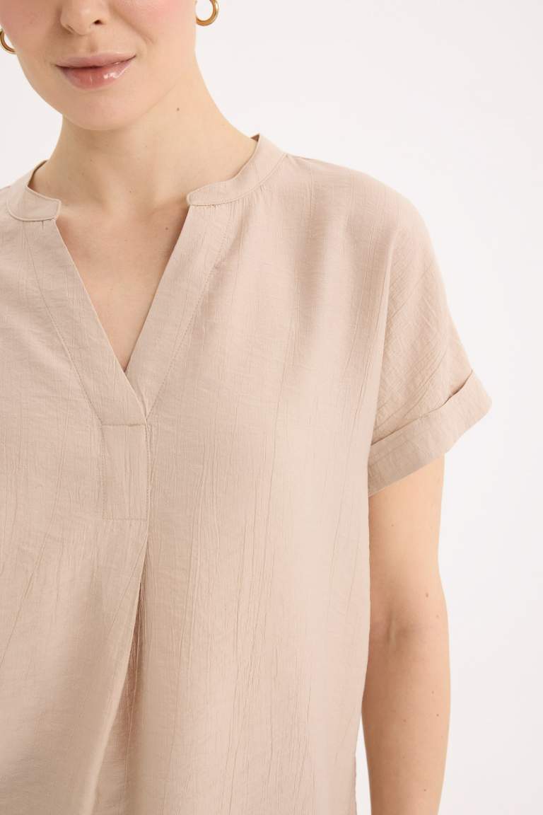 Blouse en tissu gaufré à col rond et manches courtes Coupe régulière