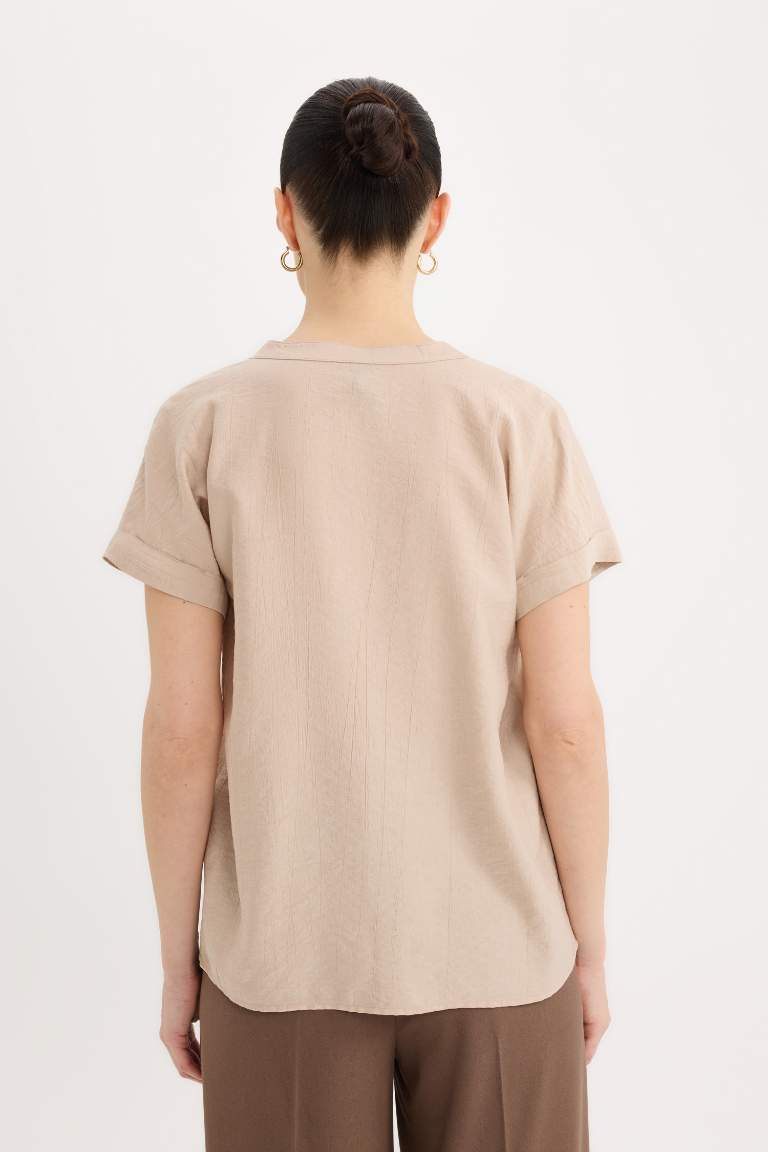 Blouse en tissu gaufré à col rond et manches courtes Coupe régulière