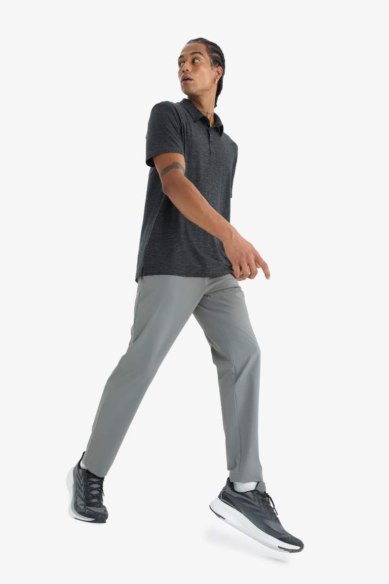DeFactoFit Slim Fit Dar Kesim Standart Paça Esnek Multifonksiyonel Dokuma Sporcu Pantolon