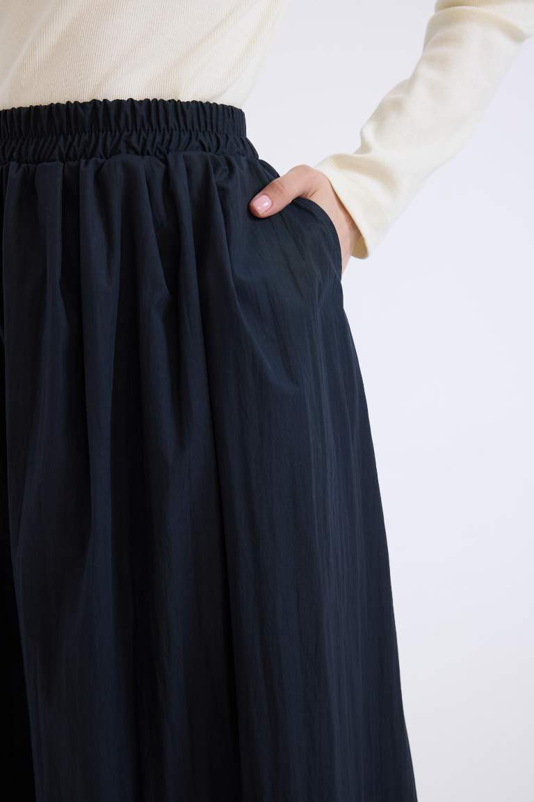 A Cut Flexible Waist Parachute Fabric Maxi Skirt