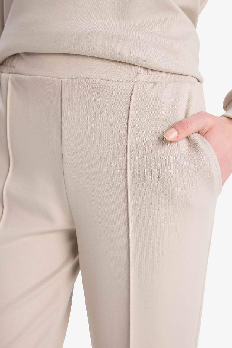 Pantalon basique avec poches et taille élastique Coupe régulière