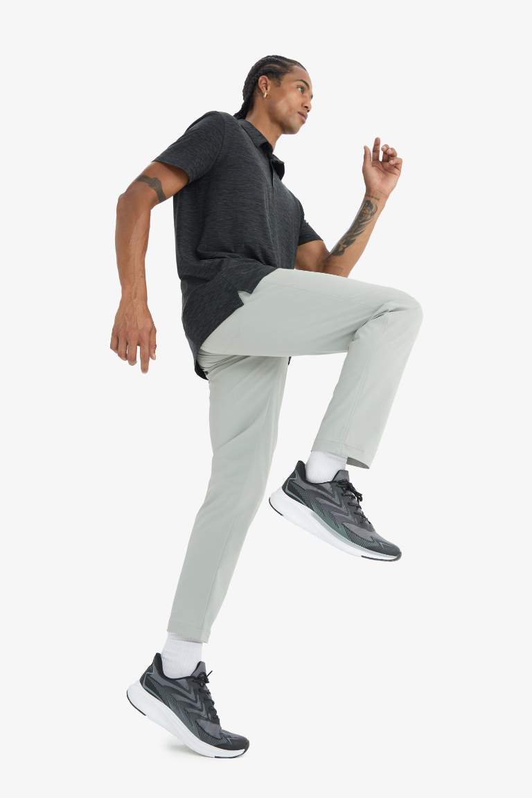 DeFactoFit Slim Fit Dar Kesim Standart Paça Esnek Multifonksiyonel Dokuma Sporcu Pantolon
