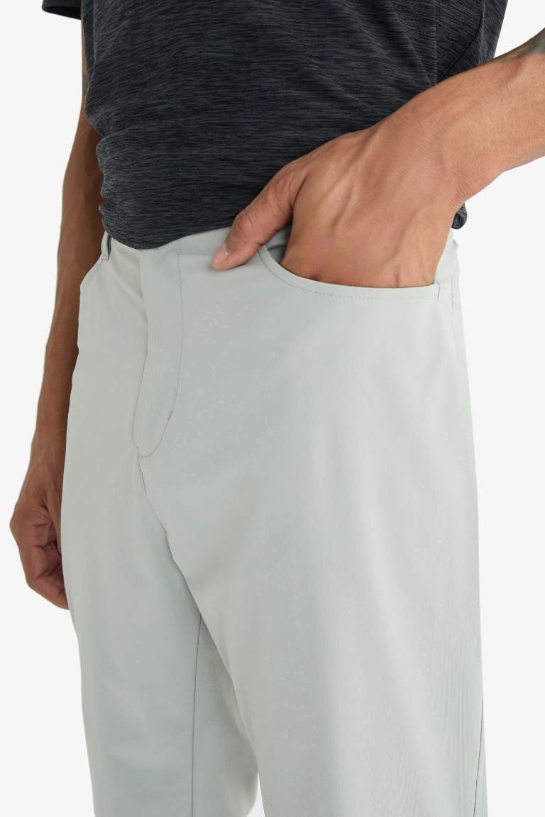 DeFactoFit Slim Fit Dar Kesim Standart Paça Esnek Multifonksiyonel Dokuma Sporcu Pantolon