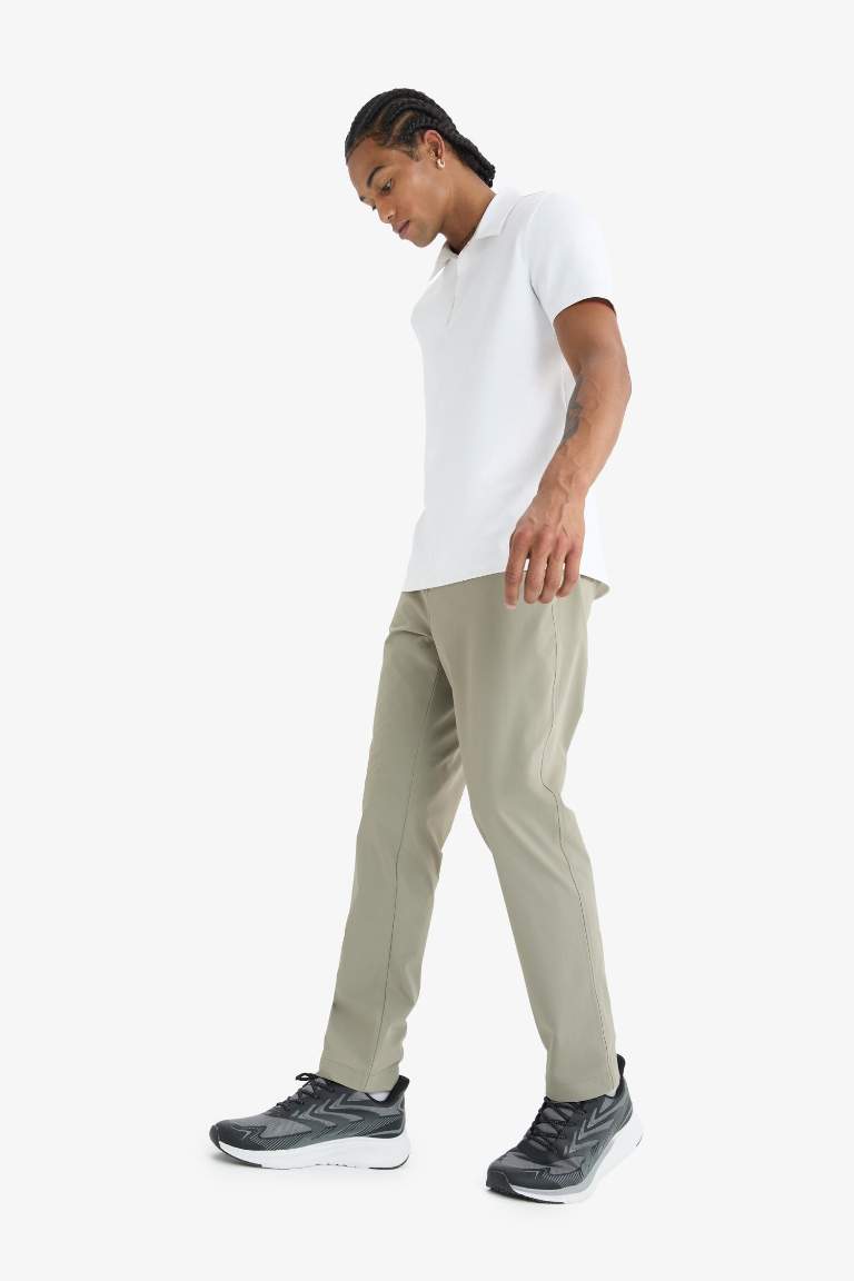 DeFactoFit Slim Fit Dar Kesim Standart Paça Esnek Multifonksiyonel Dokuma Sporcu Pantolon