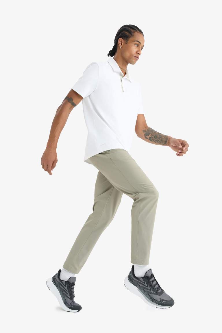 DeFactoFit Slim Fit Dar Kesim Standart Paça Esnek Multifonksiyonel Dokuma Sporcu Pantolon