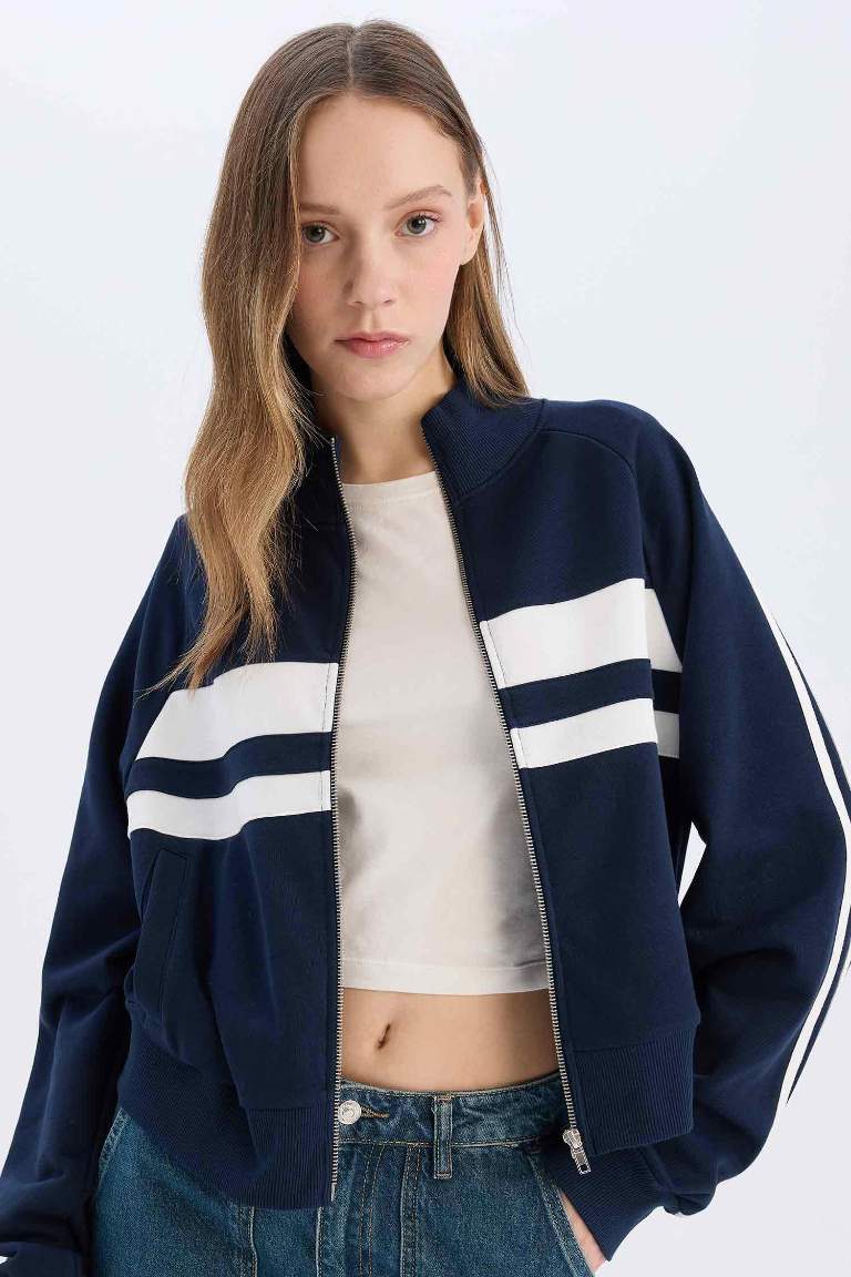 Sweatshirt à col montant avec fermeture zip et poches