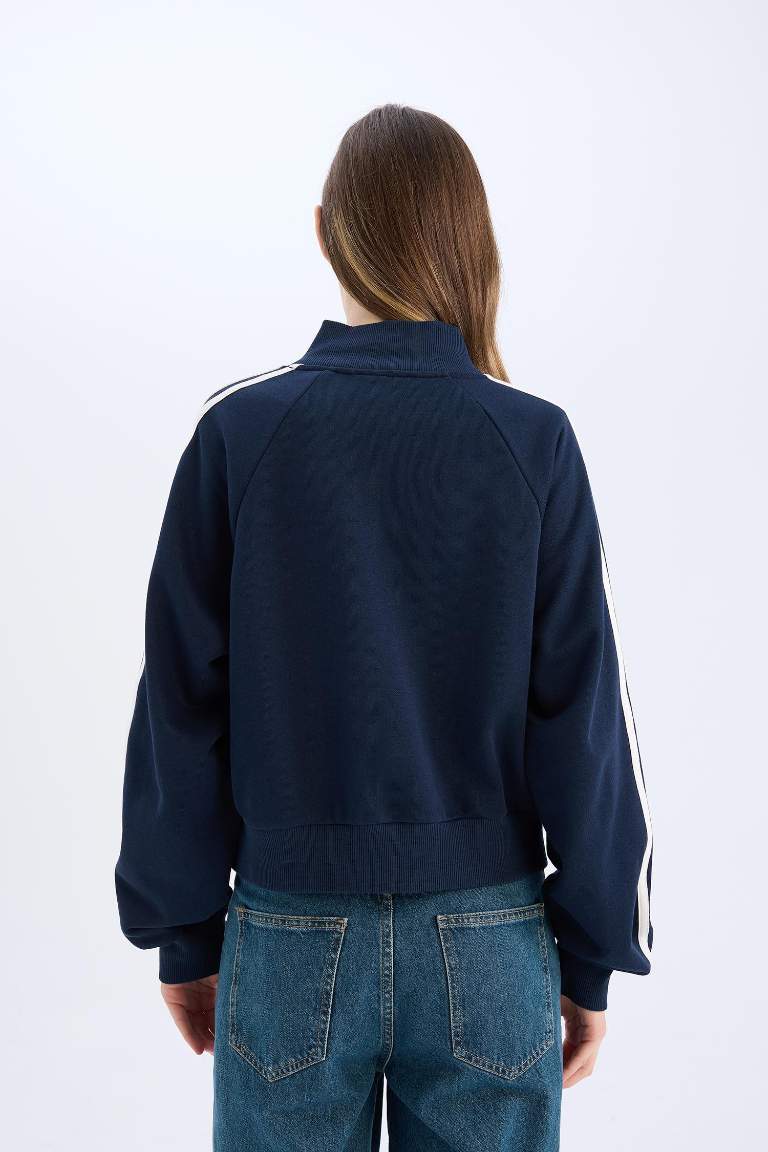 Sweatshirt à col montant avec fermeture zip et poches