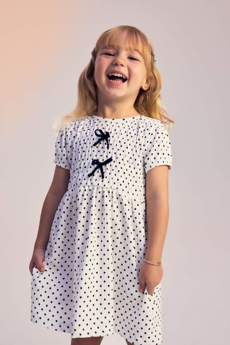 فستان بيبي بناتي منقط قصة عادية نص ردن بياخة مستديرة