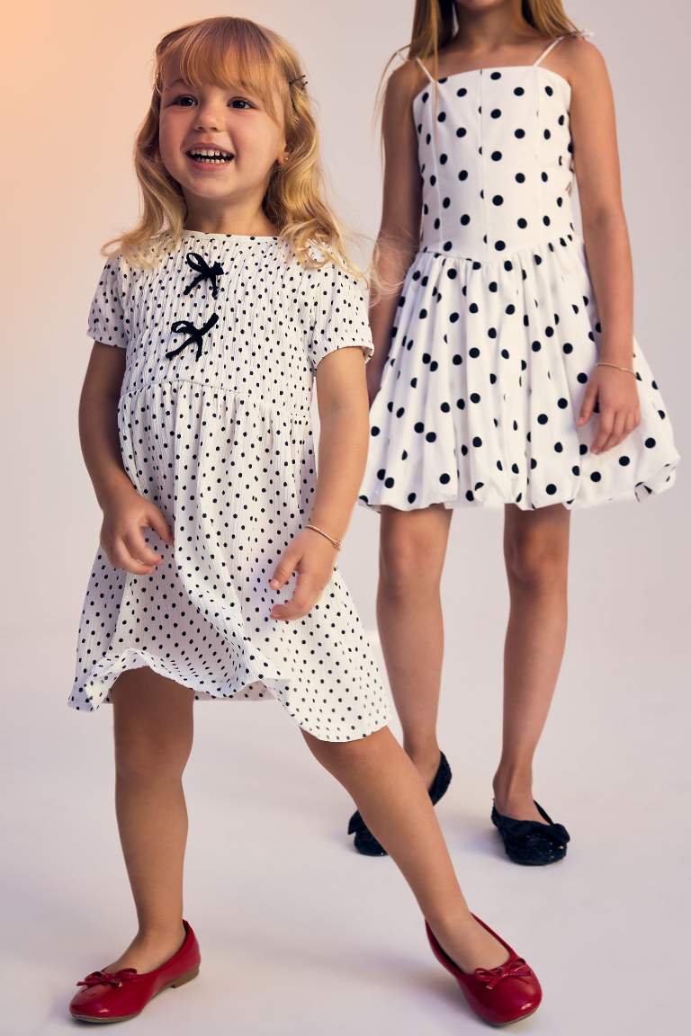 فستان بيبي بناتي منقط قصة عادية نص ردن بياخة مستديرة