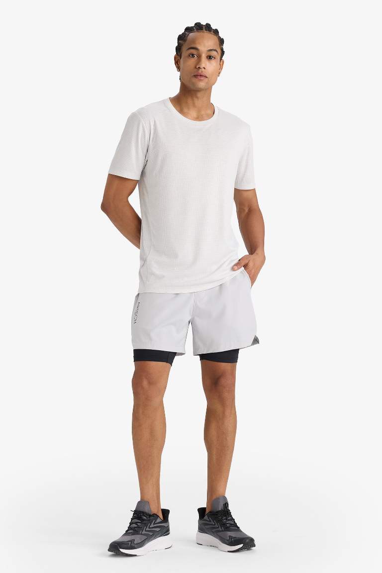 Тканые спортивные шорты DeFactoFit Slim Fit с узкими штанинами и встроенными леггинсами