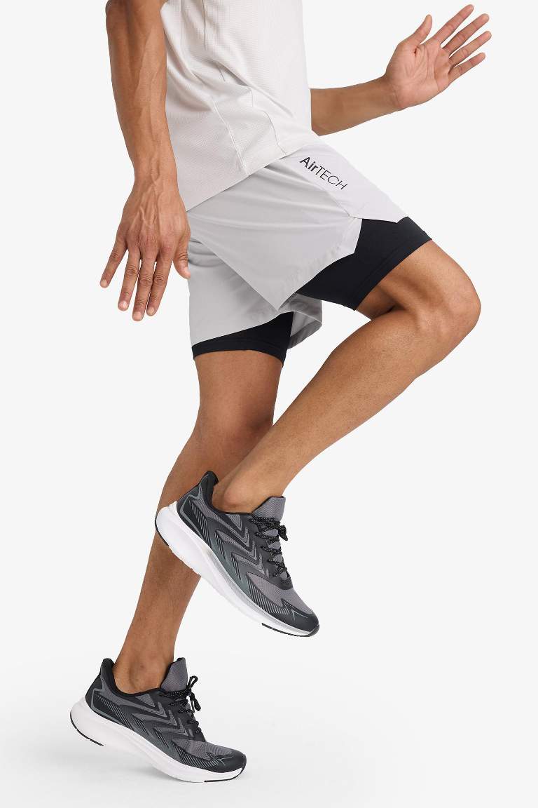 Тканые спортивные шорты DeFactoFit Slim Fit с узкими штанинами и встроенными леггинсами