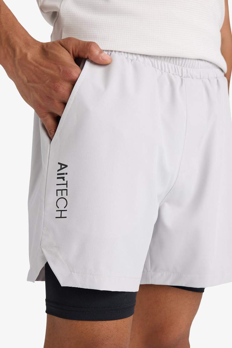Тканые спортивные шорты DeFactoFit Slim Fit с узкими штанинами и встроенными леггинсами