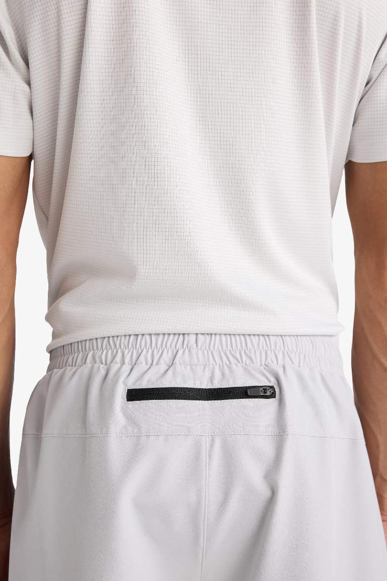 Тканые спортивные шорты DeFactoFit Slim Fit с узкими штанинами и встроенными леггинсами