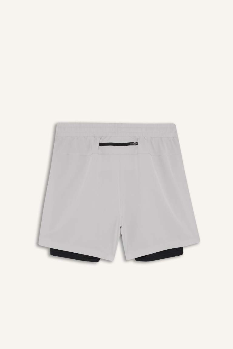 Тканые спортивные шорты DeFactoFit Slim Fit с узкими штанинами и встроенными леггинсами